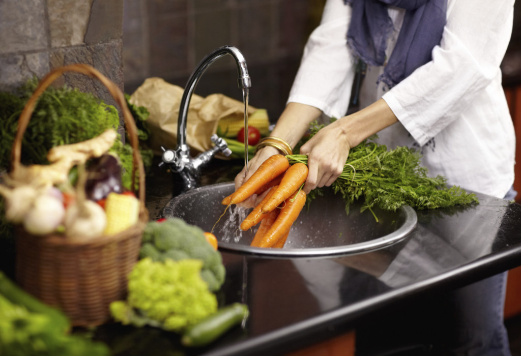 Cleaning off her fresh vegetables